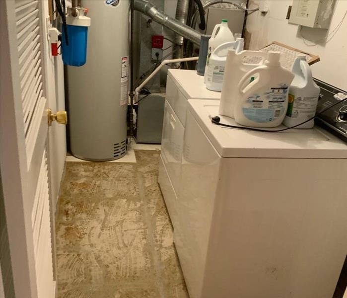 floor removed, washer dryer in place 