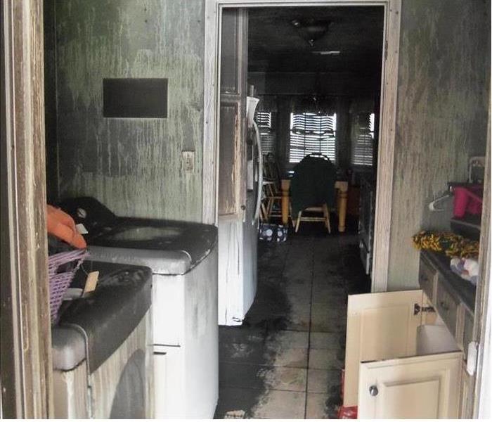 sooty and blackish walls and appliances from a fire