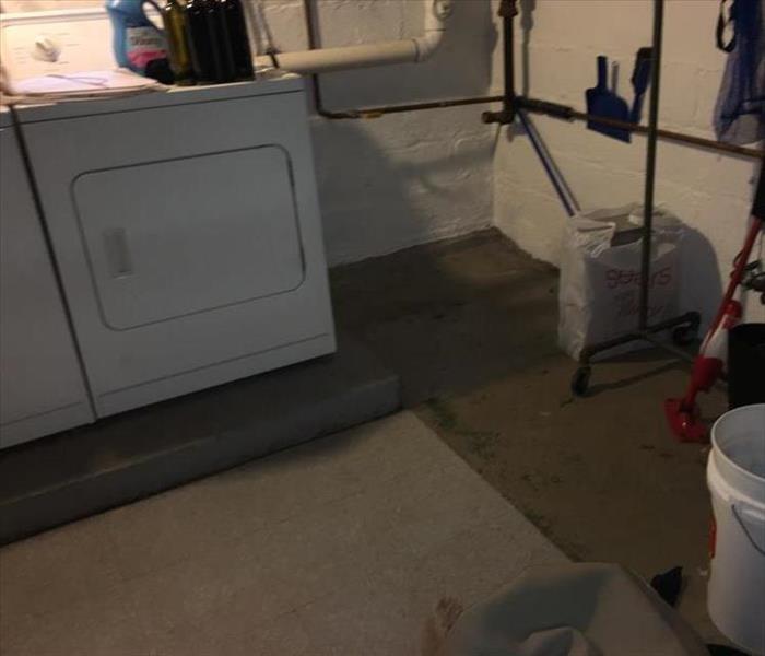 Laundry room with concrete flooring with washer and dryer 