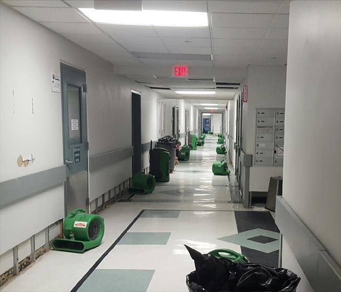hallway with SERVPRO drying equipment setup