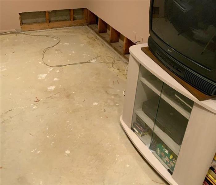 carpet removed flood cuts on wall in room tv