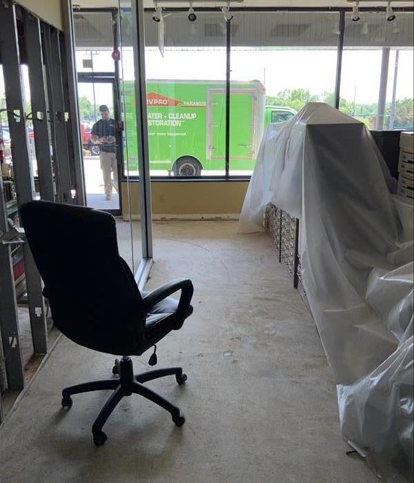 office with furniture covered with plastic sheeting