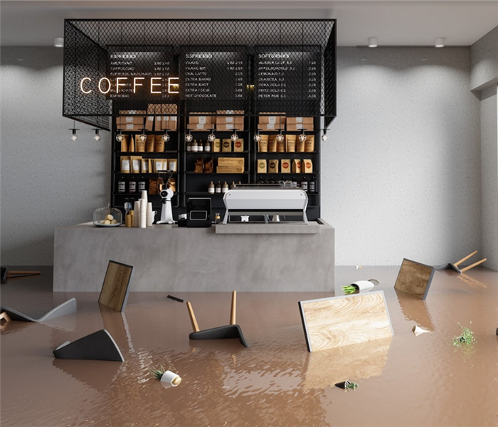 a flooded coffee shop with furniture floating around everywhere